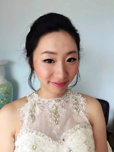 Shy smiling Asian bride